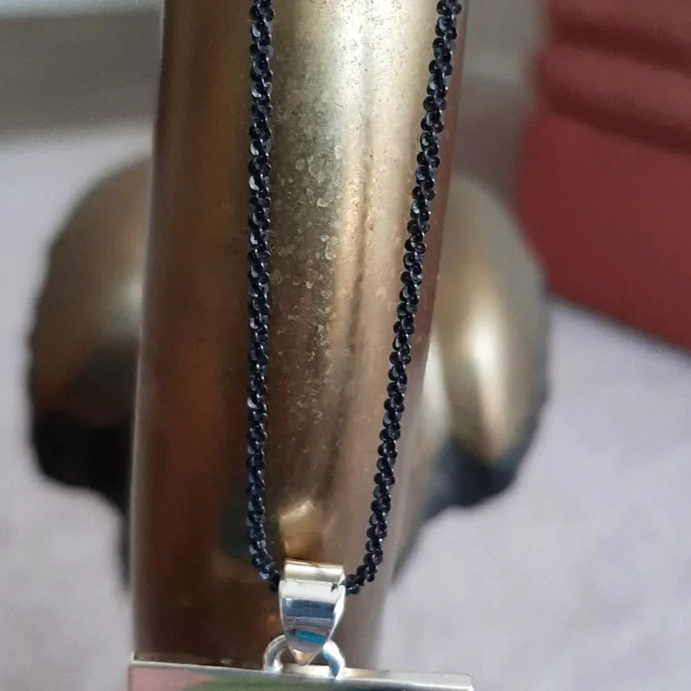 Vintage necklace with silver toned pendant with palm tree and gold half moon